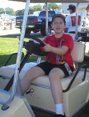 Jason Pratt in his beloved golf cart. Photo by Walt Huff