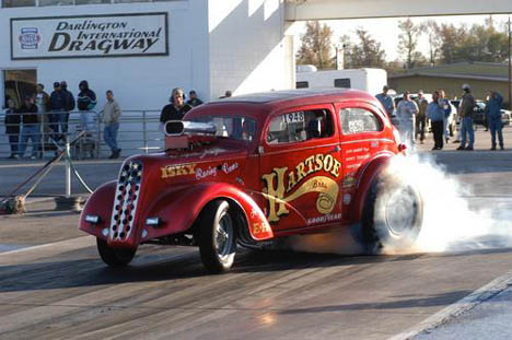 With Gwyn Hartsoe looking on, Heath Daniel did his best to recapture the glory of gasser racing at Darlington. Photo by Richards-Woods