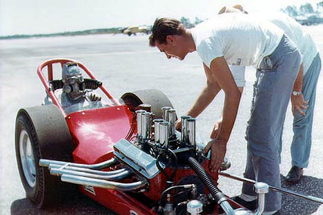 Ben Diener gets strapped into the beast as Sparks and Careccia make last minute adjustments. Photo by Jim Hill