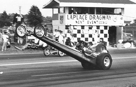 Ronnie Martin gets big air in the Holley & Venables Top Fuel Dragster. Photo by Dan Watley