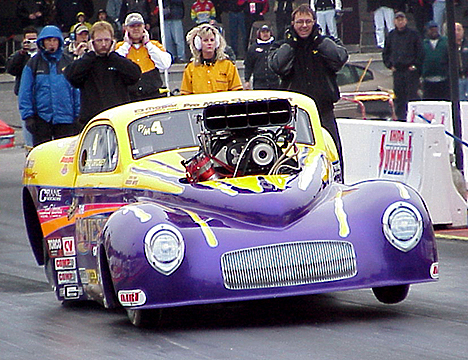 Troy Critchley has Roy Singleton's Majesty Homes WiIlys Pro Mod flying. Photo by Brian Wood