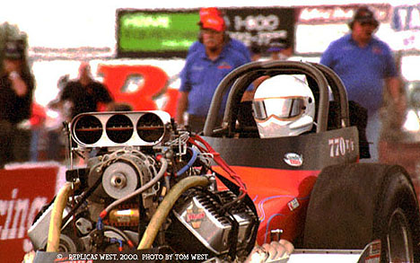 Tim Gibson leaves the line in the MasterCam nostalgia fuel dragster. Photo by Tom West