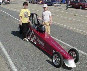 Jason and Emily pose with the Putnam Race Cars Dragster. It won't be long, Emily! Photo by Tim Pratt