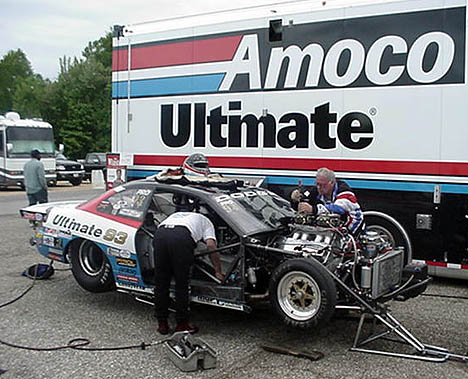 The Johnson Racing team works on the big Hemi between rounds. Photo by TIm Pratt