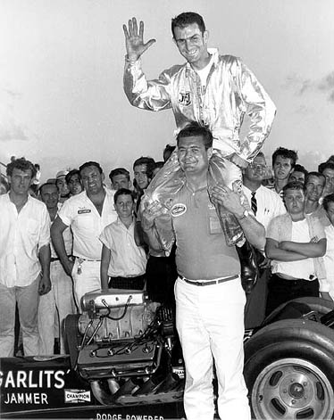 Buster Couch lifts up Don Garlits after Don ran Florida's first 200 mph pass. Photo by Jim Hill