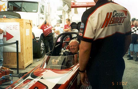 New drag fan Raiford uses face muscles he's never used before sitting in Doug's Top Fuel car when it fired up. Photo by Berserko Bob