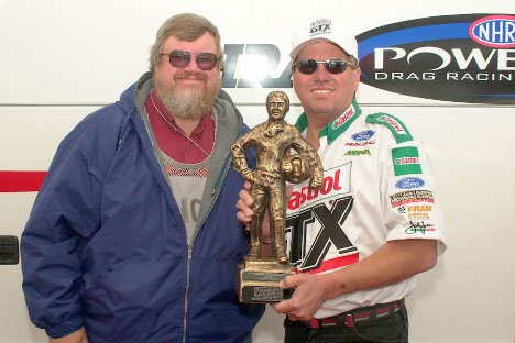 Greg Gage presents EMPA's Driver of the Year trophy to John Force. This was the highpoint of Force's day.