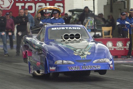 Bruce Mullins does a wheelie in alcohol funny car. Photo by Greg Gage