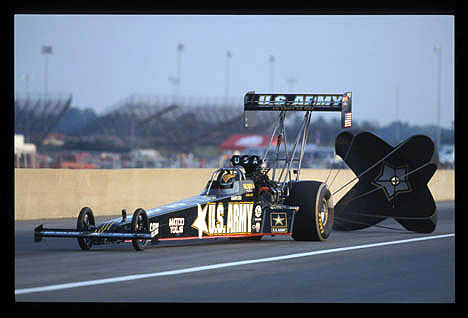 Tony Schumacher pulls the chutes at Indy 2002. Photo by Ron Lewis