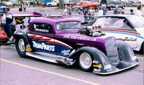 Jeff Brozovich in the Trim Parts '37 Chevy Nitro Coupe. Photo by Ernie Broughton