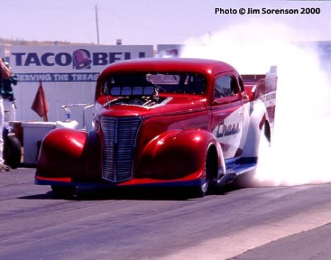Howard Cross's '38 Chevy Pro Mod gets busy at the famous Boise Nightfire Nationals. Photo by Jim Sorenson