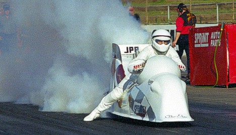 The Edge lays down an awesome burnout. Photo by Dave Murray