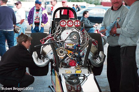 Jim Murphy's Nostalgia Top Fueler gets some between rounds maintenance at the 2001 March Meet. Photo by Robert Briggs