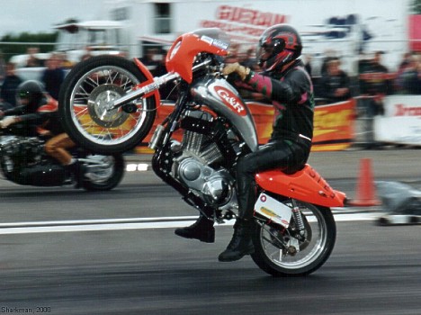 Super Twin rider shoots for the stars with a MAJOR wheelie! Photo by Sharkman