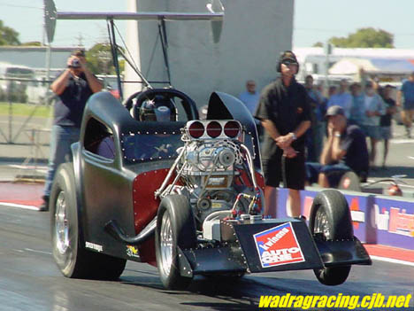 Steve McGrath pulls the wheels in his blown small block altered. Photo by Luke Nieuwhof