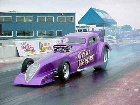 Larry Reep just keeps on truckin' with his series of purple Grim Reeper cars. Photo by Chris Graves