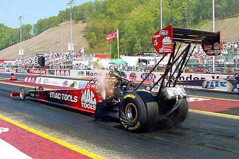 Doug Kalitta wrinkles the slicks on the Mac Tools digger at Bristol. Photo by Greg Gage