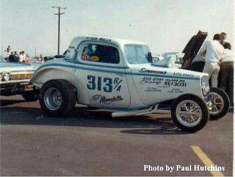 Jack Ditmars' Ford Coupe altered in the pits at Irwindale 1966. Photo by Paul Hutchins