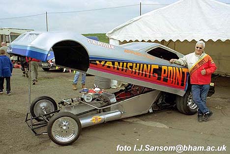 Miller poses with the quickest machine in drag racing history. Photo by Ivan Sansom
