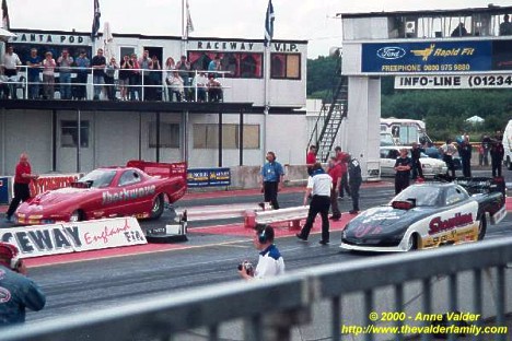 Fuel Funny Cars line up at Santa Pod Raceway in England. Photo by Anne Valder