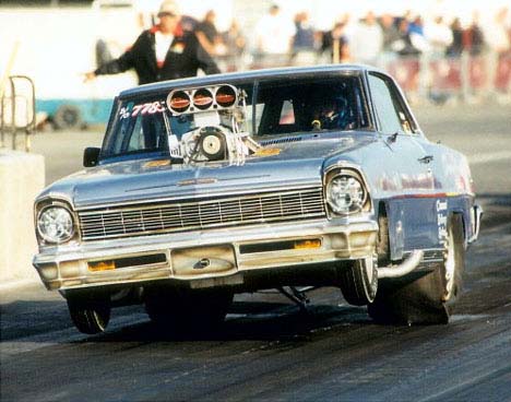 Bill Galli gets the wheels up in his wild B/Gasser. Photo by Bryan Ellis