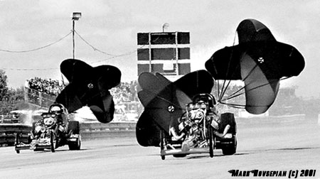 Dale Pulde and Rick McGee pop the chutes on the vintage top fuelers. Photo by Mark Hovsepian