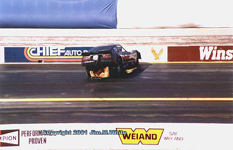 John Collins does a gut check as he wrestles his flaming Z Car into a spin. Photo by Jim White