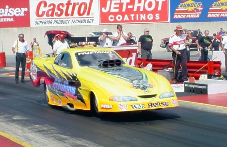 Bruce Mullins became the quickest Roots car in the NHRA with a 5.80, 240 blast at Reading. Photo by Greg Gage