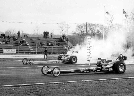 A frequent sight in Division 1 Top Fuel races -- the Hemi Hunter hooked up and moving and its opponent up in smoke. Photo from the Hemi Hunter archives