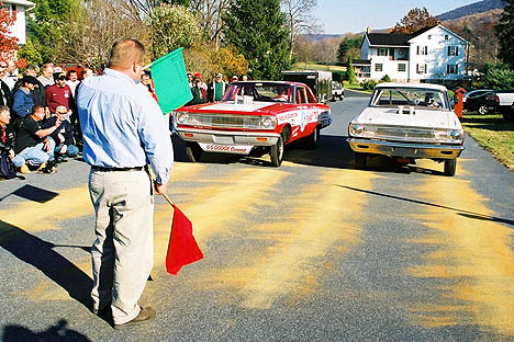 Recreating the days of factory experimental stock cars and a flag man. Photo by Greg Gage