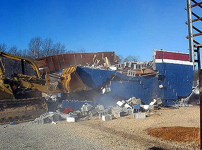 The bulldozer delivers the final blow that takes her down. Photo by Stephen Jones