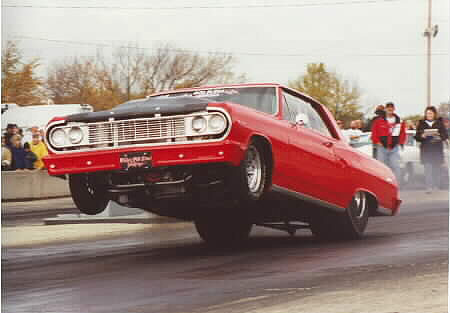 Big Outlaw Super Stock Chevy pulls the wheels on another entertaining run. Photo by Cory Janssen