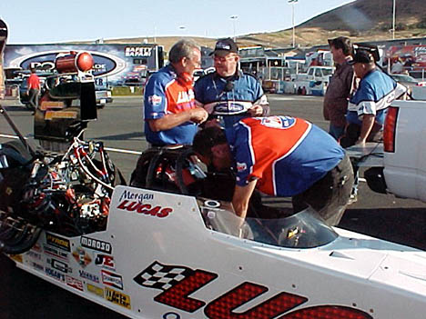 Jerry Darien and an NHRA official chat while Randy Green makes sure that brand new 'shoe' Morgan Lucas is ready in the Lucas Oil A/FD that ran a fine 5.29, 270 mph. Photo by Tim Marshall
