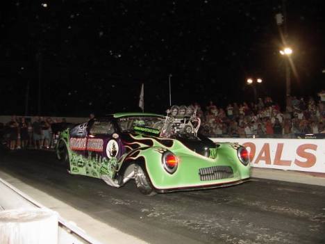 With blood red eyes glowing, the Grave Digger took the measure of Anthony White's Corvette. Roger Richards photo