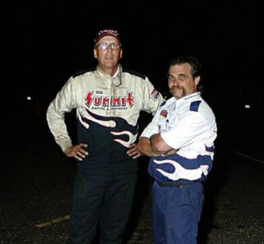 Carl Baker and Summit crewmember discuss strategy before a round. Photo by Stephen Hawes